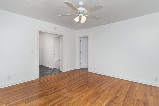 spare room featuring ceiling fan and wood-type flooring