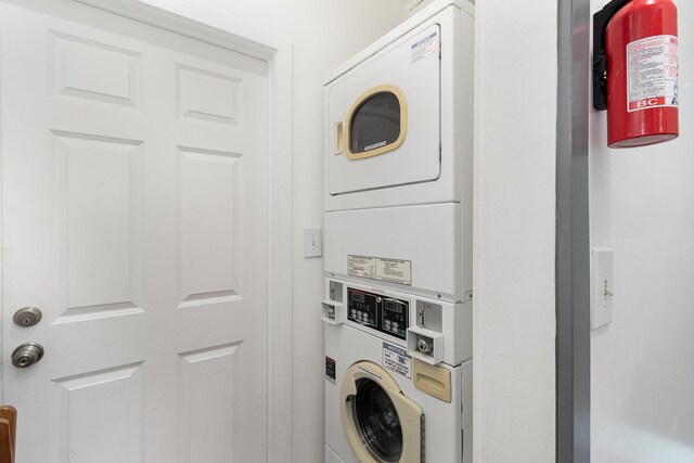 laundry room featuring stacked washer and clothes dryer