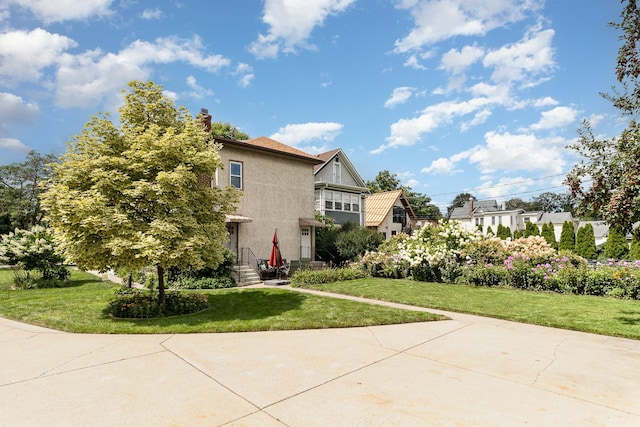 view of side of home featuring a yard