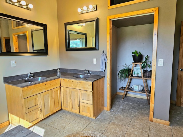 bathroom featuring vanity and tile patterned flooring