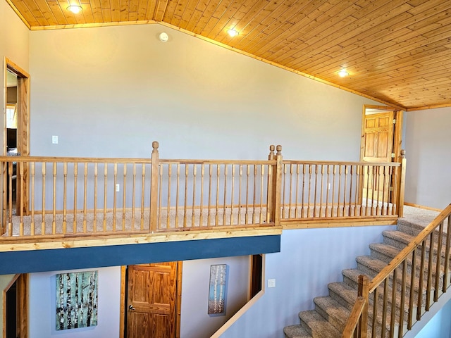 staircase featuring lofted ceiling and wood ceiling