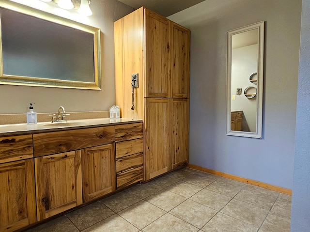 bathroom featuring tile patterned floors and vanity