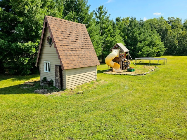 view of yard featuring a playground, a shed, and a trampoline