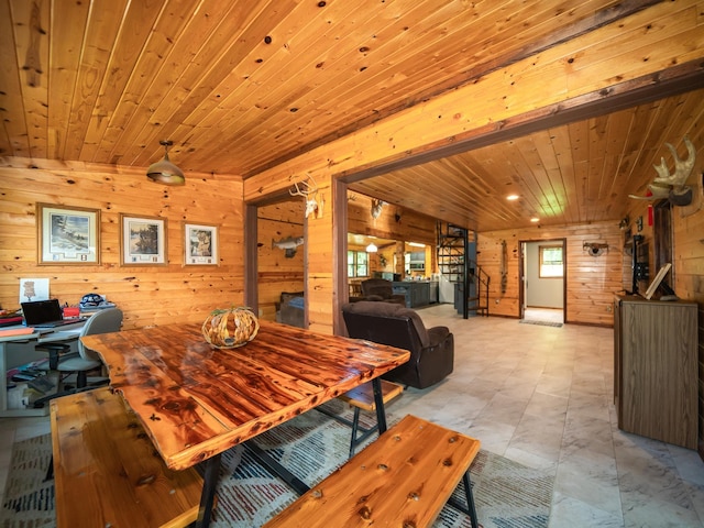 tiled dining room with wood walls and wooden ceiling