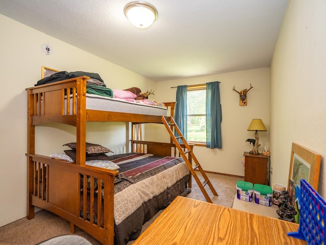 bedroom featuring light carpet