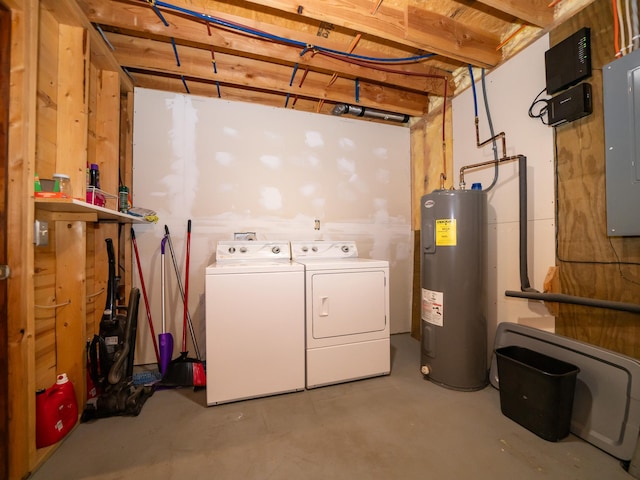 basement with water heater, independent washer and dryer, and electric panel