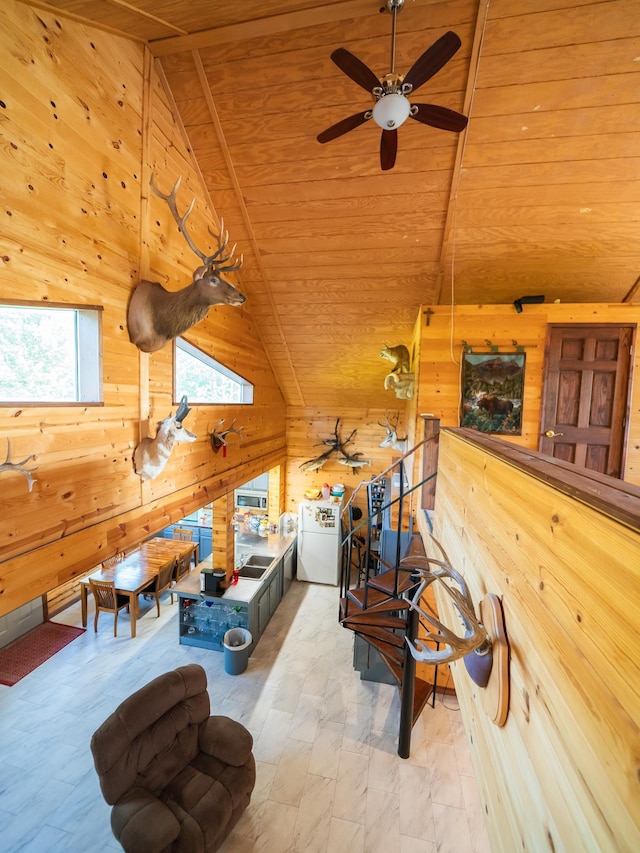 interior space featuring multiple windows, lofted ceiling, and wood ceiling