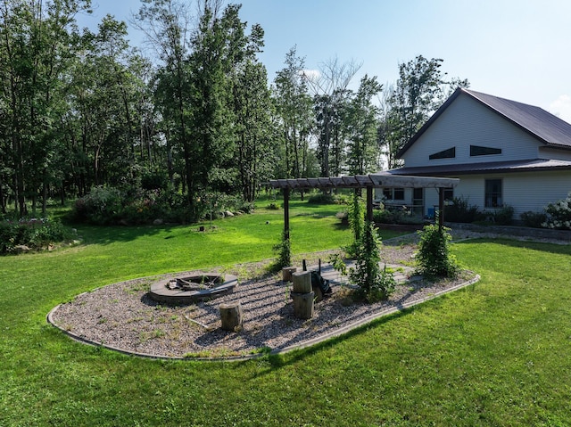 view of yard with a fire pit