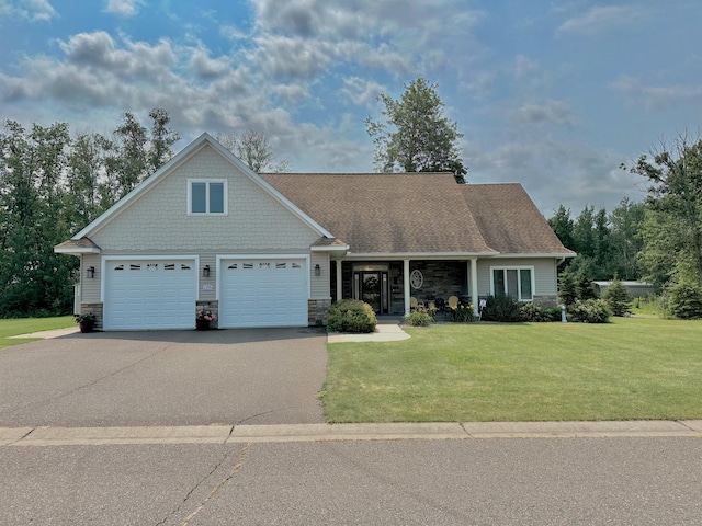 view of front of home featuring a garage and a front yard