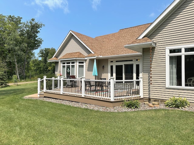 1225 Dorothy St, Isle, MN 56342 - back of property with a lawn, roof with shingles, and a deck