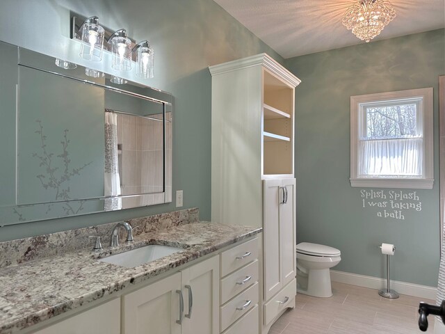 1225 Dorothy St, Isle, MN 56342 - bathroom with toilet, baseboards, tile patterned flooring, and vanity