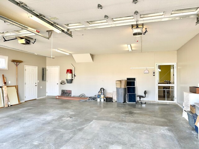 1225 Dorothy St, Isle, MN 56342 - garage with a garage door opener, a central vacuum unit, and electric panel