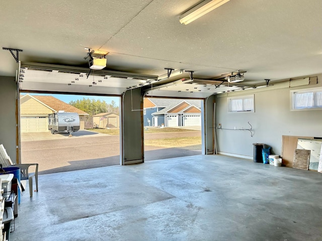 1225 Dorothy St, Isle, MN 56342 - garage with a garage door opener and a storage unit