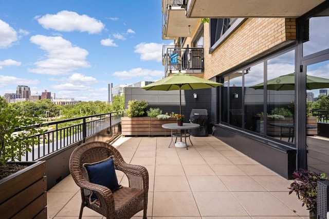 view of patio / terrace with a balcony