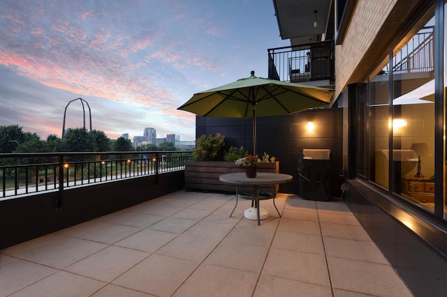 patio terrace at dusk with a balcony