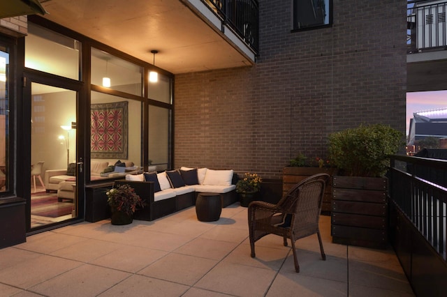 view of patio / terrace with a balcony and an outdoor hangout area