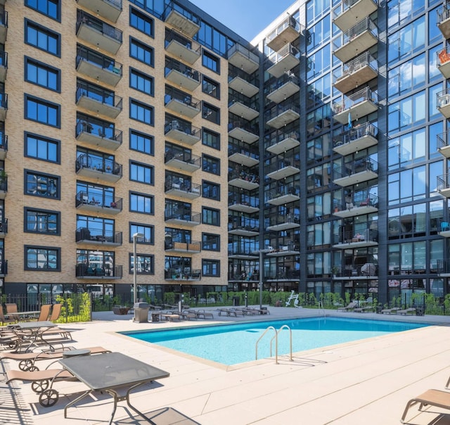 view of swimming pool with a patio