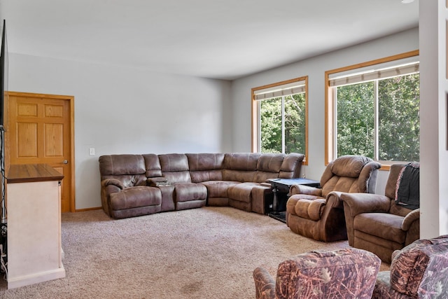 carpeted living room with baseboards