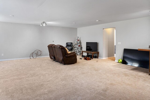 living room with baseboards and carpet flooring