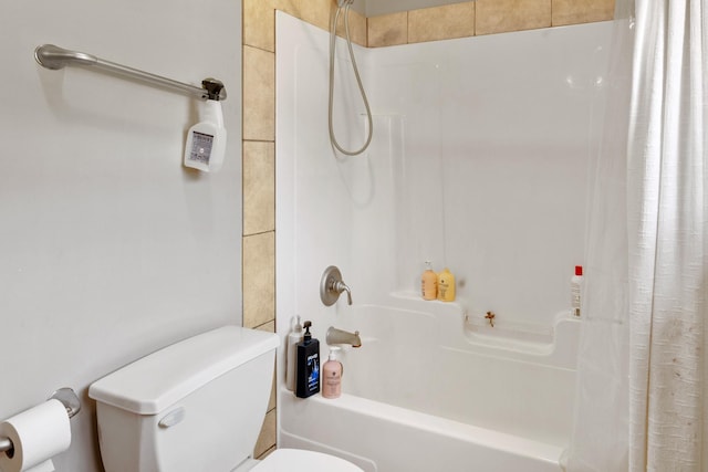bathroom featuring shower / bath combination with curtain and toilet