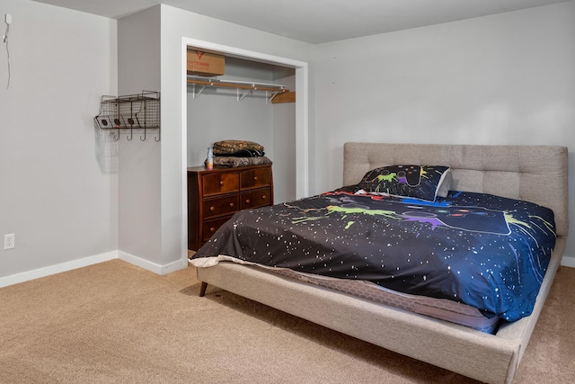 bedroom featuring baseboards, a closet, and carpet
