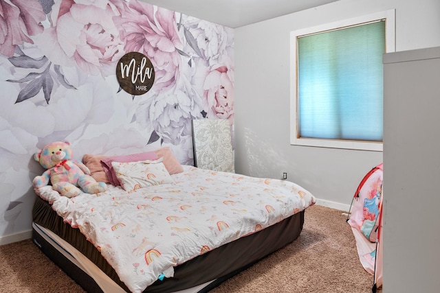 bedroom featuring baseboards and carpet floors