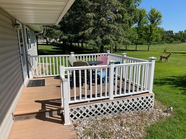 deck featuring a lawn