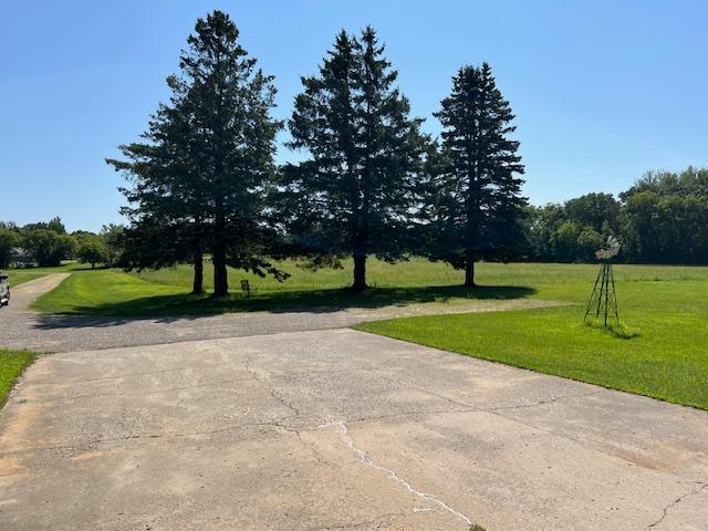 view of home's community with a lawn