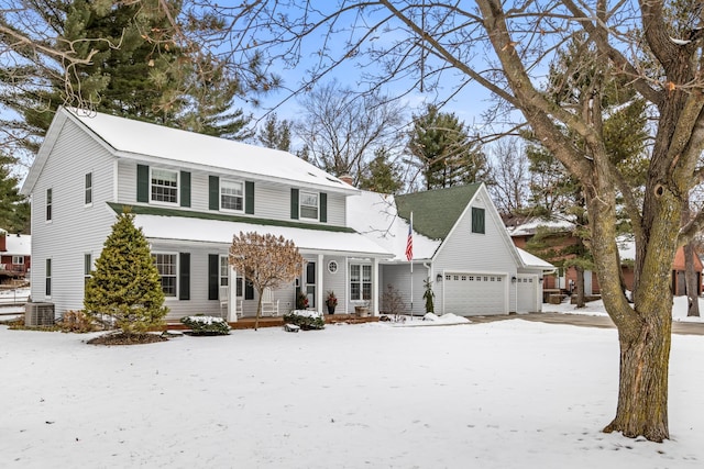 view of front of house with cooling unit and a garage