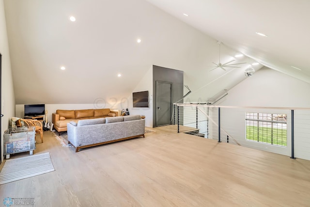 bedroom with light wood-type flooring and lofted ceiling