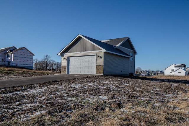 view of property exterior featuring a garage