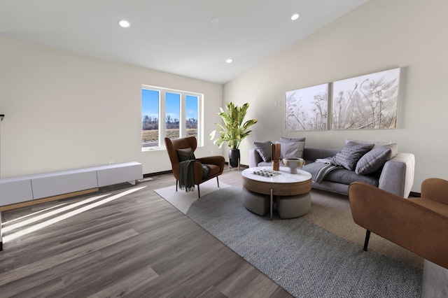 living room featuring hardwood / wood-style floors and vaulted ceiling