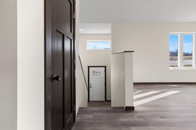 corridor featuring dark hardwood / wood-style flooring