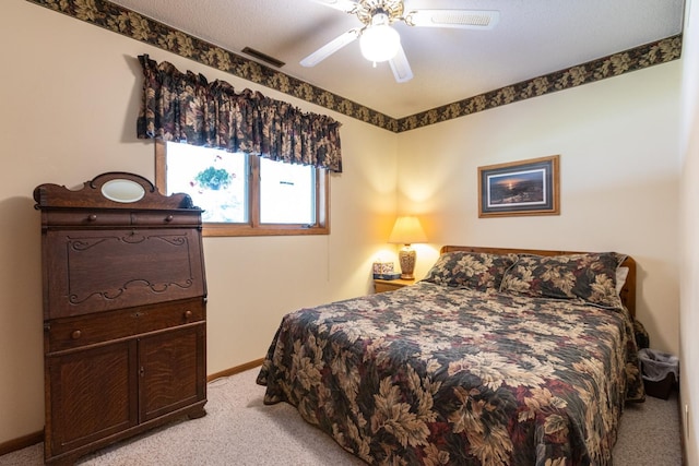 bedroom with ceiling fan and light colored carpet