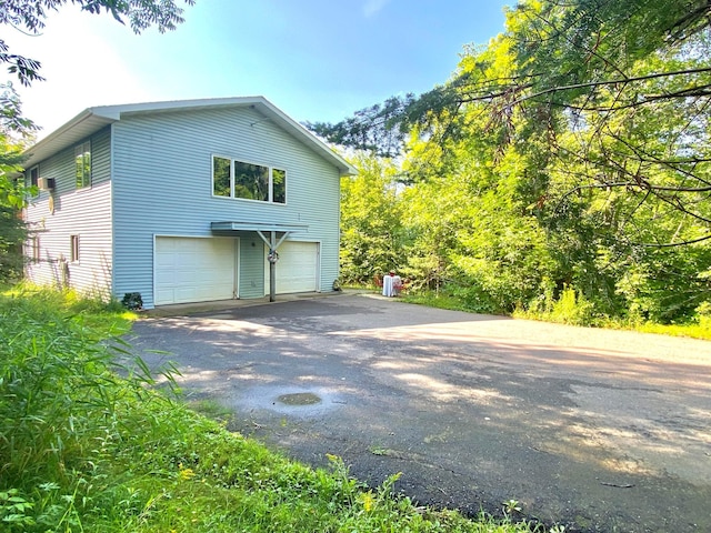 view of side of property featuring a garage