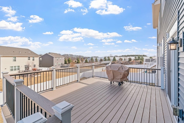 wooden terrace featuring a residential view