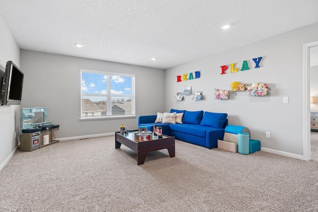 carpeted living room featuring recessed lighting, a textured ceiling, and baseboards