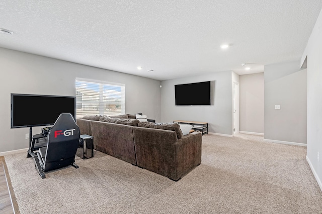 living area featuring a textured ceiling, carpet floors, recessed lighting, and baseboards