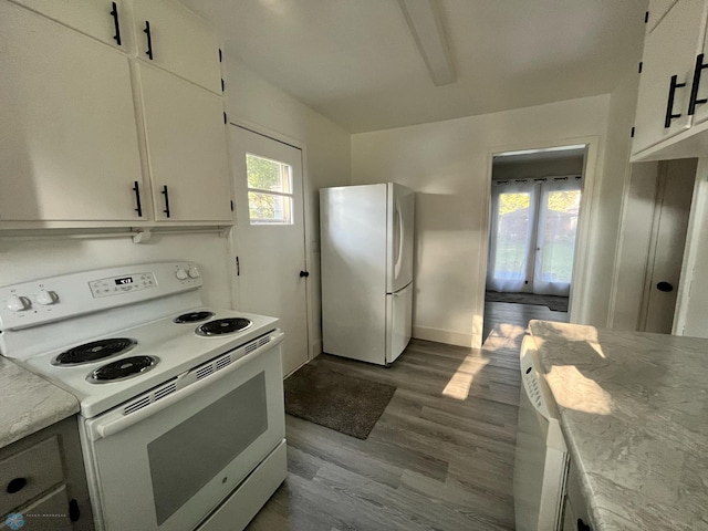 kitchen featuring white cabinets, plenty of natural light, light hardwood / wood-style floors, and white appliances