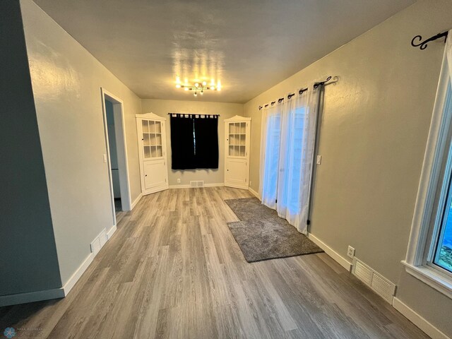 corridor featuring wood-type flooring