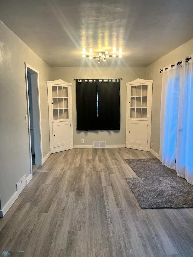 unfurnished dining area with hardwood / wood-style floors