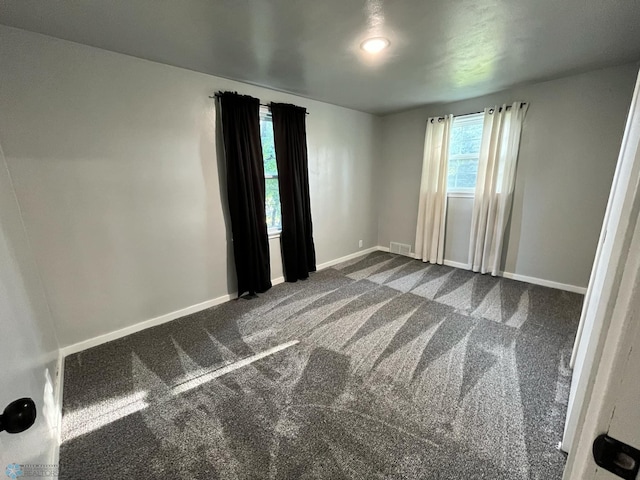 spare room featuring carpet flooring