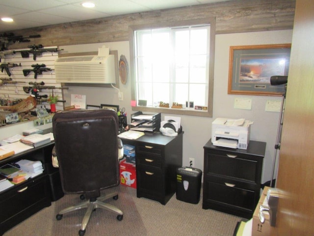 office space featuring a wall unit AC and carpet floors