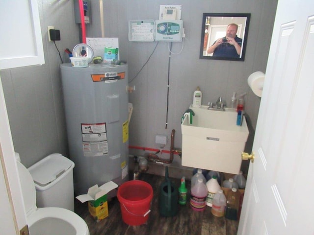 utilities featuring sink and water heater