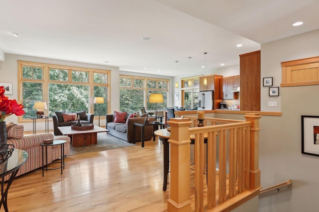 living area featuring recessed lighting and light wood-style flooring