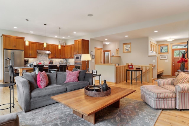 living room featuring recessed lighting and light wood-style flooring