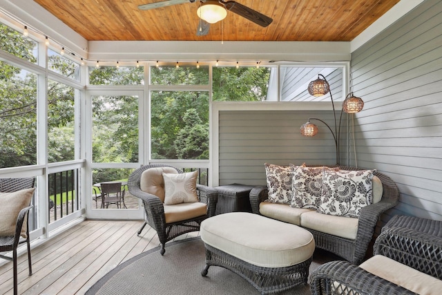 sunroom with wooden ceiling and a ceiling fan