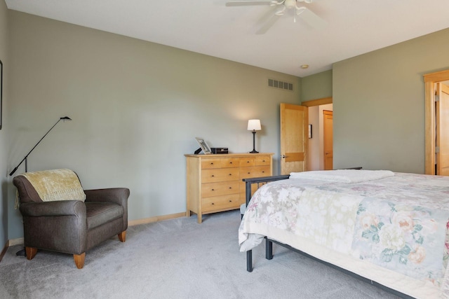 bedroom featuring visible vents, light carpet, baseboards, and ceiling fan