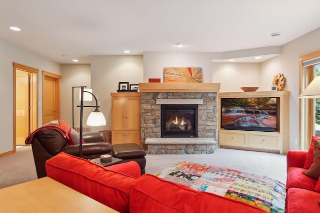 living room featuring carpet flooring, recessed lighting, a fireplace, and baseboards