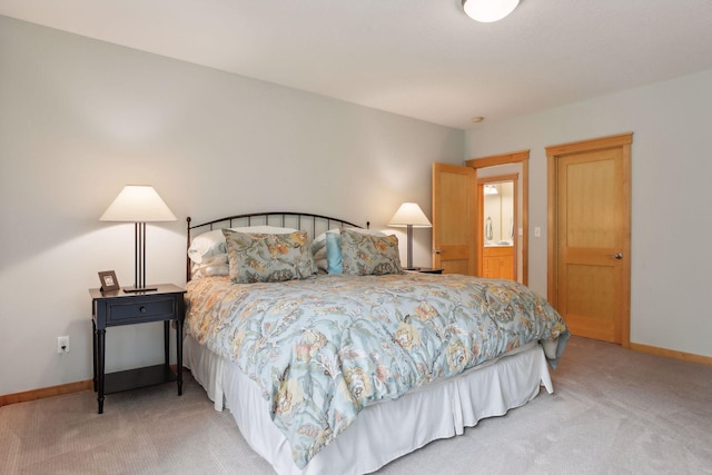 carpeted bedroom featuring baseboards